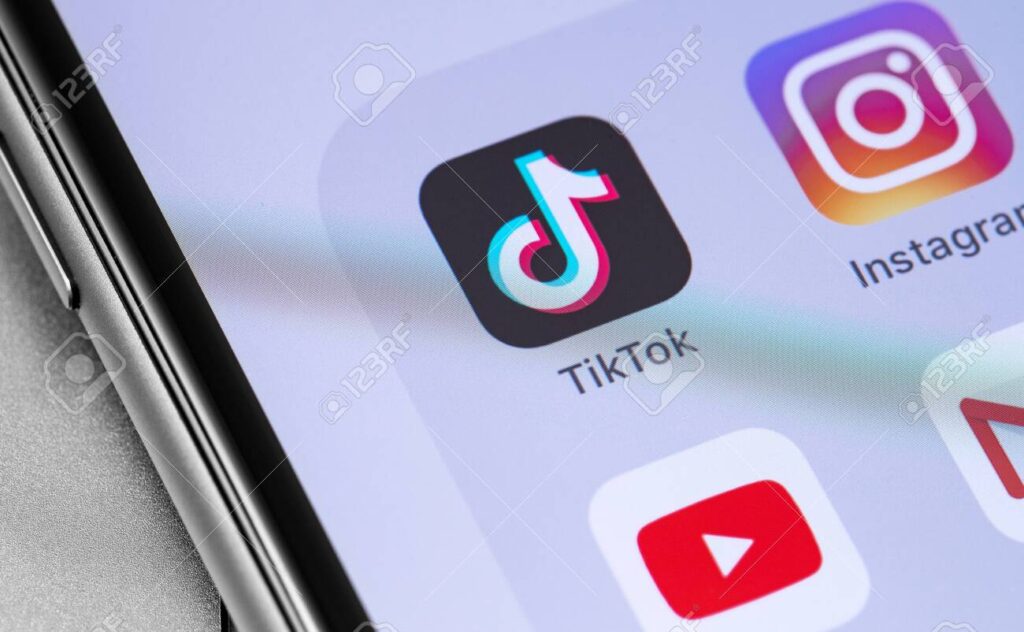 TikTok icon and popular mobile apps on the screen smartphone clo - Brill Creations