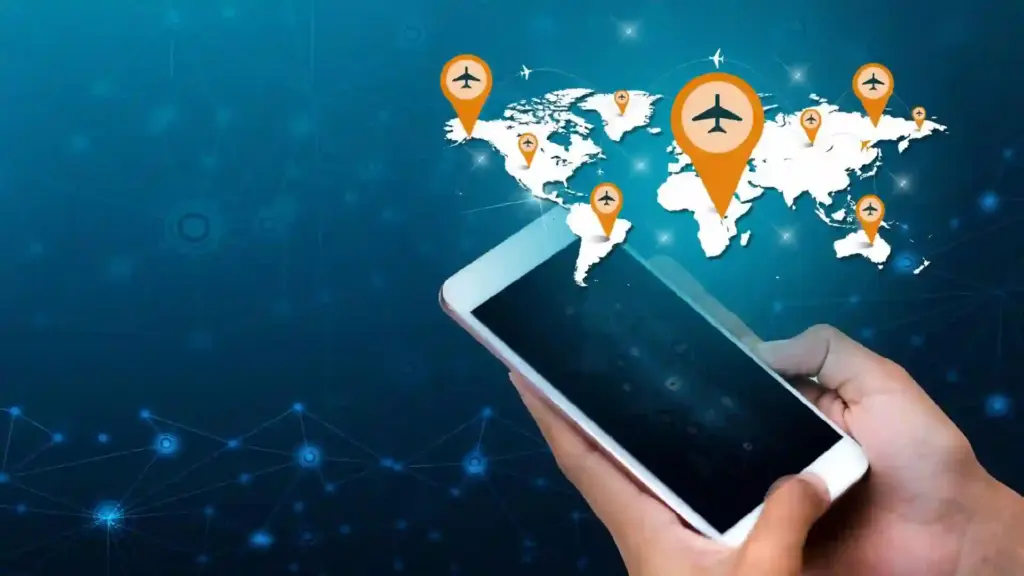 Hand holding a smartphone with a world map and orange airplane pins marking key locations.