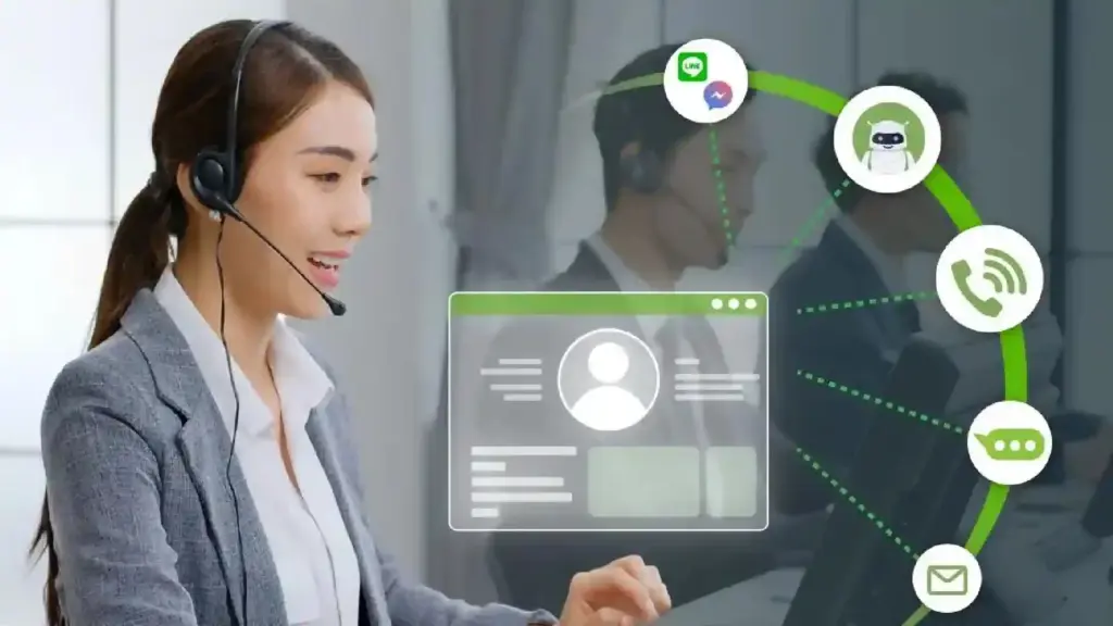 Customer service agent wearing a headset, interacting with a transparent screen showing chat and contact icons.