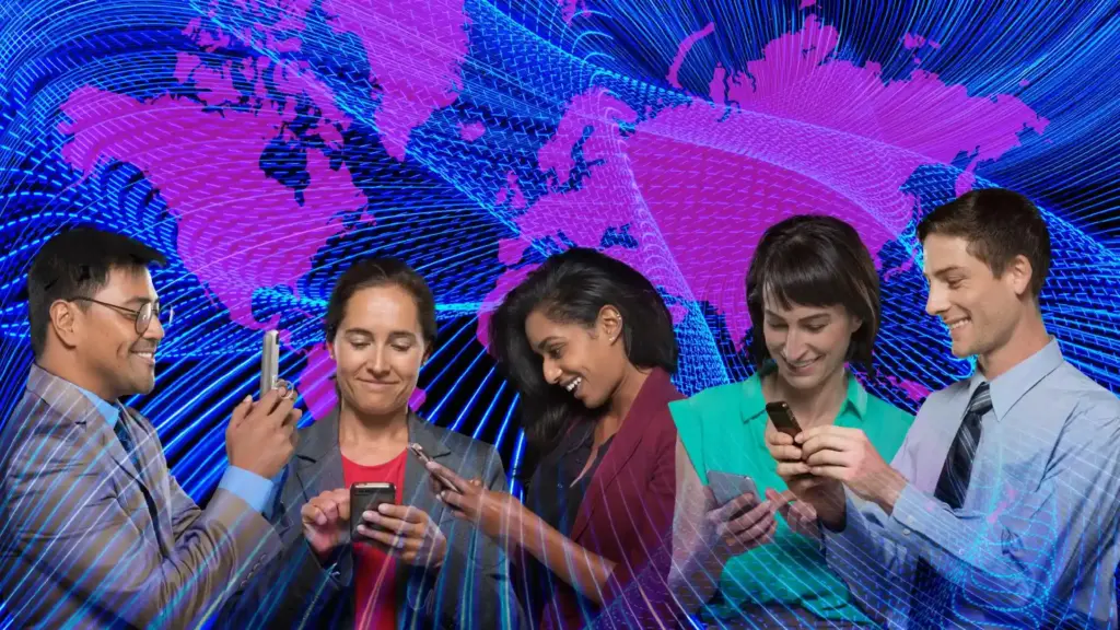 Diverse professionals looking at smartphones against a blue digital world map backdrop, collaborating on tech.